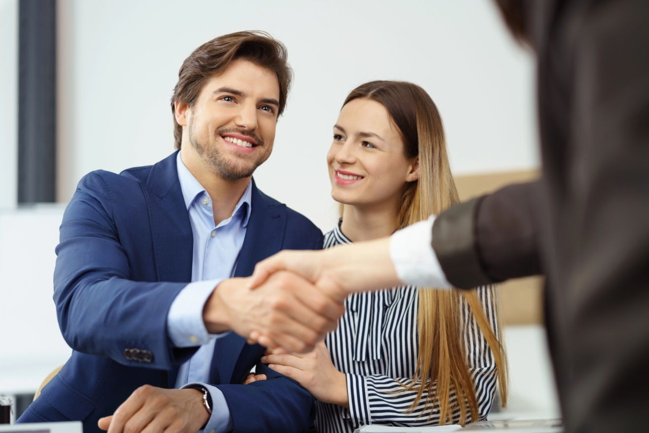 Couple Shake Hands with Lawyer